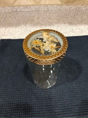 decorative glass canister featuring a gold-toned metal lid & Flowers